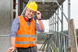 A man wearing safety hat and safety vest
